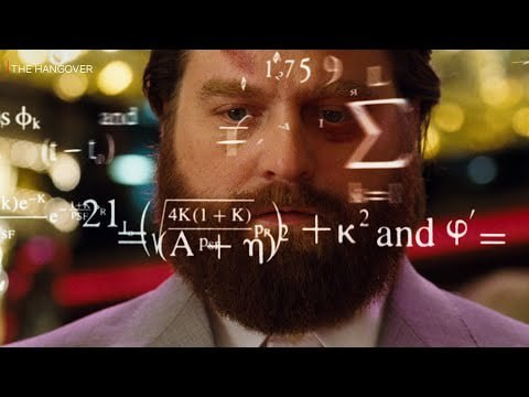Scene from The Hangover: a man stares intensely while complex math equations float around his head, visualizing doing GRE math under pressure.